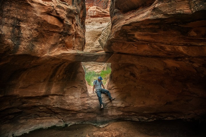 a man riding on top of a rock